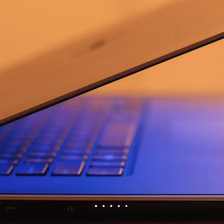 opening laptop for news updates and insights on screen