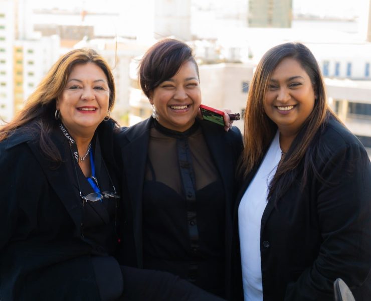 three ladies of Boomerang Management team smiling in photo. Left to right, Jacqueline, Dorianne & Natasha.