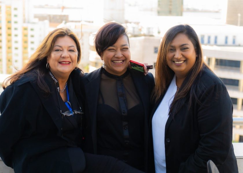 three ladies of Boomerang Management team smiling in photo. Left to right, Jacqueline, Dorianne & Natasha.